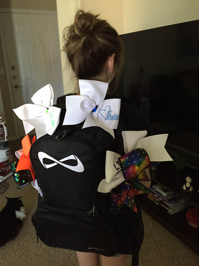 Joie's NFinity Backpack and Cheer Bows